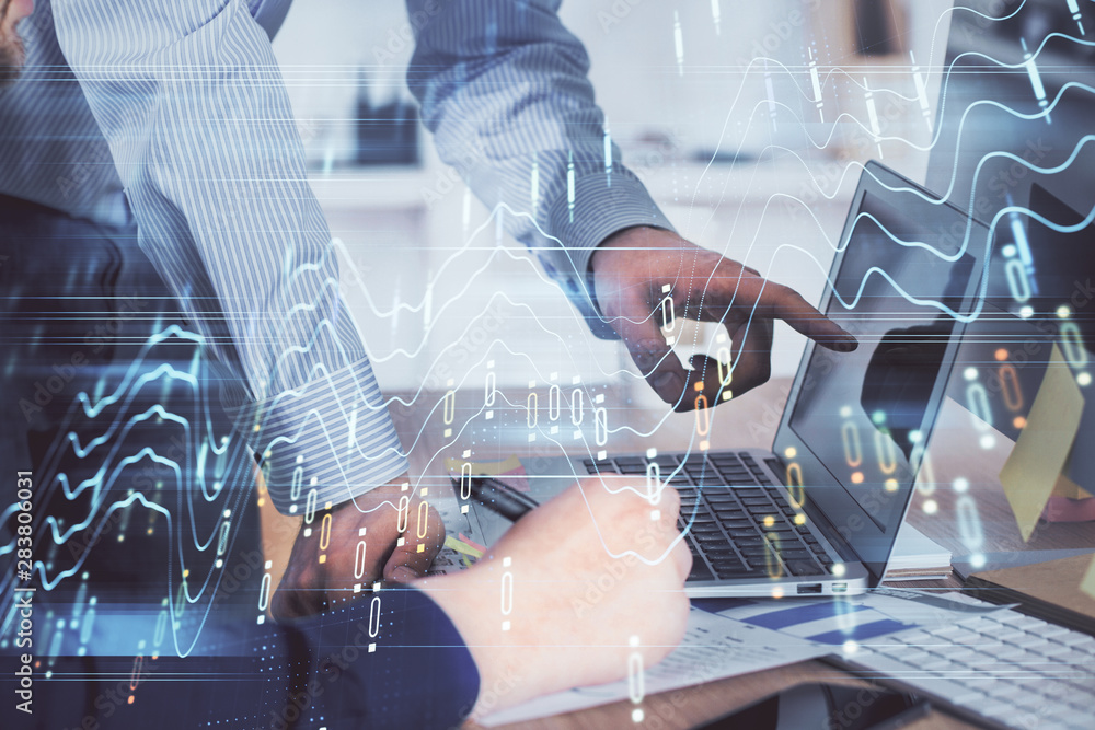 Double exposure of graph with man typing on computer in office on background. Concept of hard work. Closeup. Double exposure of graph with man typing on computer in office on background. Concept of hard work. Closeup.