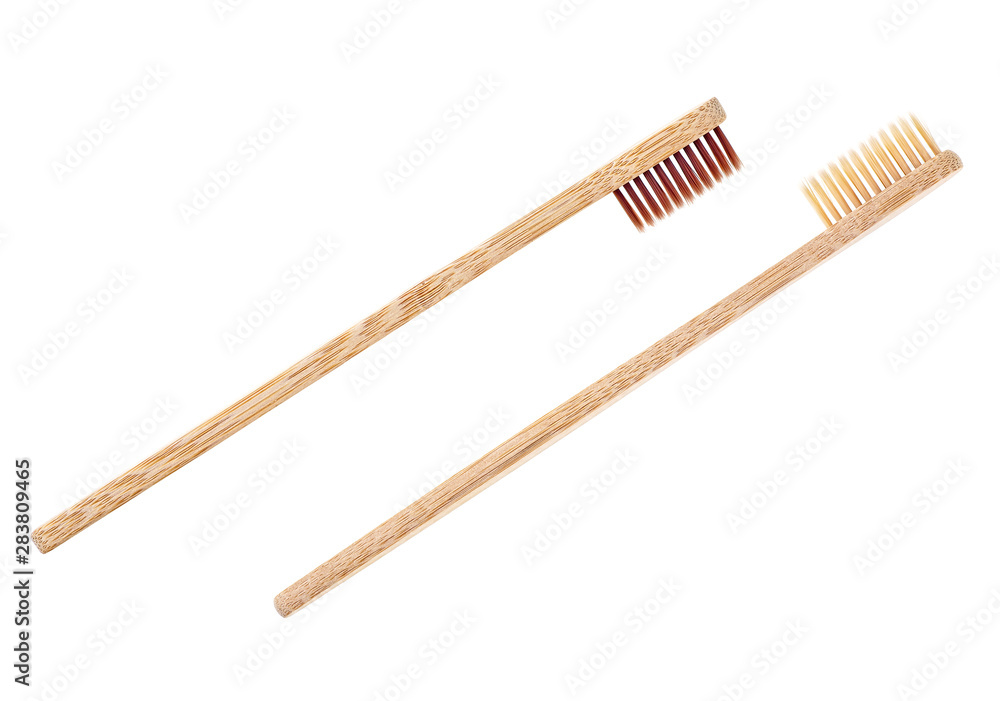 Wooden toothbrushes on a white background. Bamboo toothbrush. Wooden toothbrushes on a white background. Bamboo toothbrush.