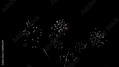 Slowed down videos of beautiful colorful fireworks on black background. Big festive evening event with great pyrotechnic show. 
