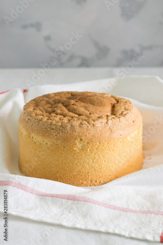 lush homemade sponge cake on a white towel