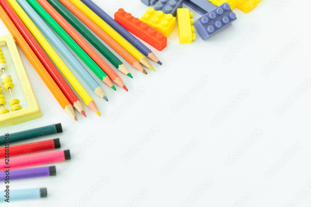 Back to school. School background with supplies. Pencils and school equipment. Multi-colored objects for drawing. Copy space Back to school. School background with supplies. Pencils and school equipment. Multi-colored objects for drawing. Copy space