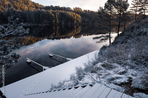 Dock by river in winter