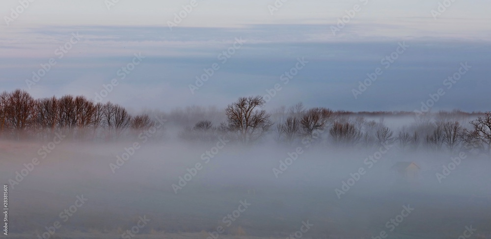 Morning fog over river and farm Morning fog over river and farm
