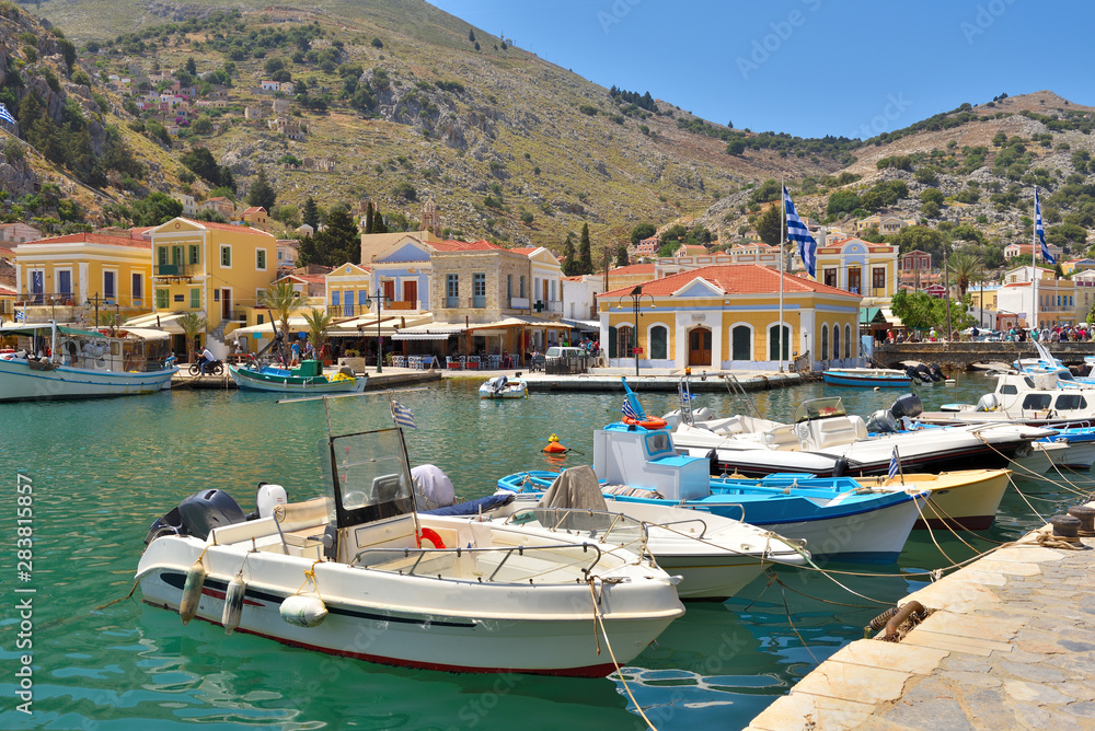 Boats moored in the bay of the island of Symi, Dodecanese, Greece