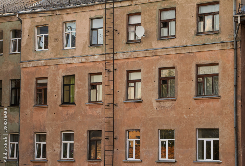 old apartment building with high windows