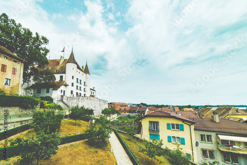 Fototapeta Naklejka Na Ścianę i Meble -  Castle on hill, ton houses and blue sky