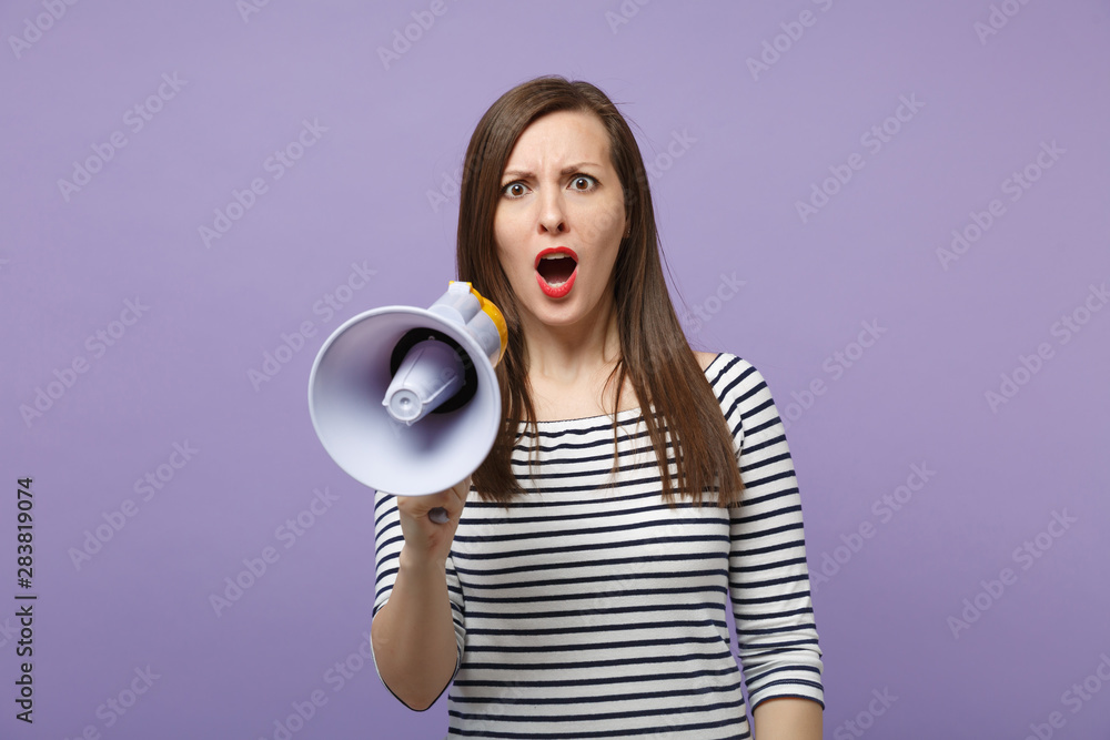 Young woman girl in casual striped clothes posing isolated on violet background studio portrait. People lifestyle concept. Mock up copy space. Scream in megaphone, announces discounts sale hurry up. Young woman girl in casual striped clothes posing isolated on violet background studio portrait. People lifestyle concept. Mock up copy space. Scream in megaphone, announces discounts sale hurry up.