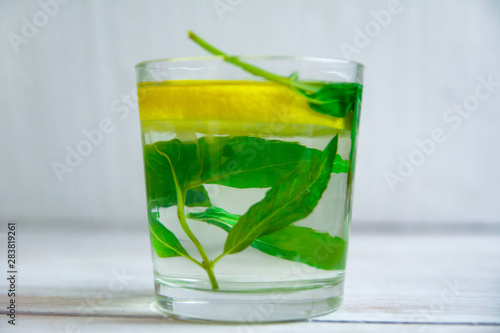 Mojito drink in a glass on a light wood background. Hot Summer. refreshing drink