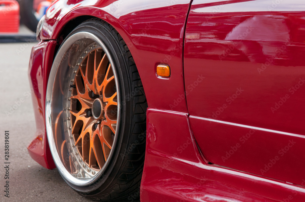 orange alloy wheels. racing red car. drift, sports car. extreme sport