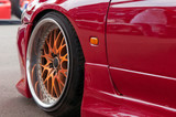 orange alloy wheels. racing red car. drift, sports car. extreme sport