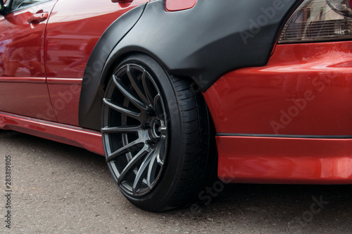 black alloy wheels. racing red car. drift  sports car. extreme sport