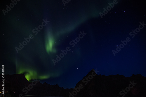 Northern lights above Reine in Lofoten islands in Norway © pierrick
