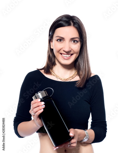 A girl holding a thermos