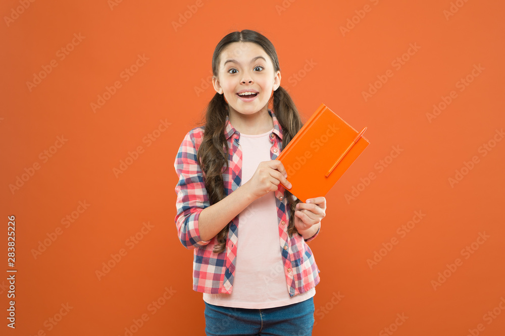 Pupil with work book. Literature and writing lesson. Schoolgirl with notebook doing homework. Learning language. Studying is exciting. Girl cute kid study with book. Interesting book. Did you know Pupil with work book. Literature and writing lesson. Schoolgirl with notebook doing homework. Learning language. Studying is exciting. Girl cute kid study with book. Interesting book. Did you know