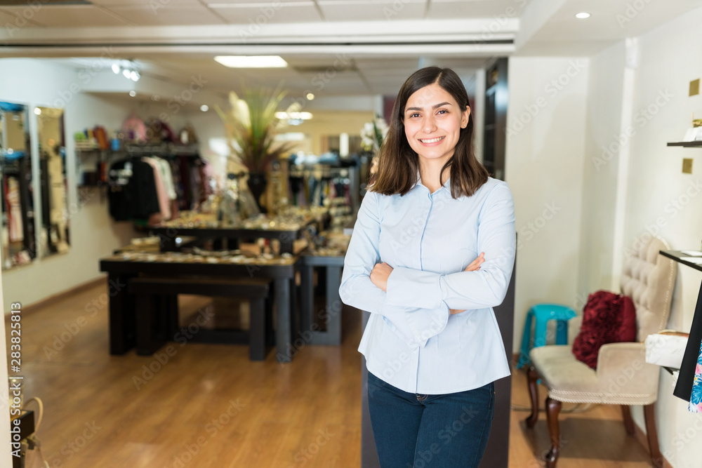 Attractive Sales Clerk In Clothing Store Attractive Sales Clerk In Clothing Store