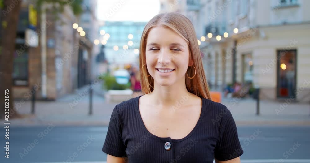 A young pretty lady smiling outdoors. Emotion A young pretty lady smiling outdoors. Emotion
