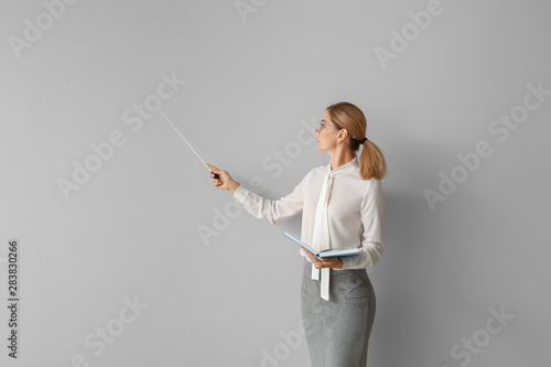 Beautiful female teacher wi...