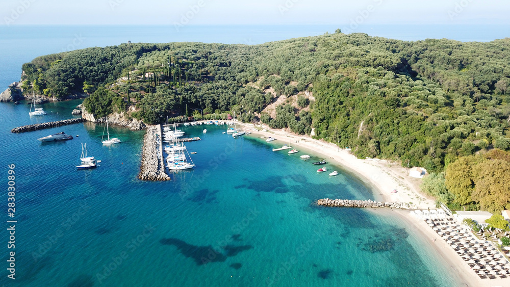Obraz premium Aerial drone photo of natural beauty bay and sandy beach of Valtos with watersports facilities and emerald sea. Parga, Epirus