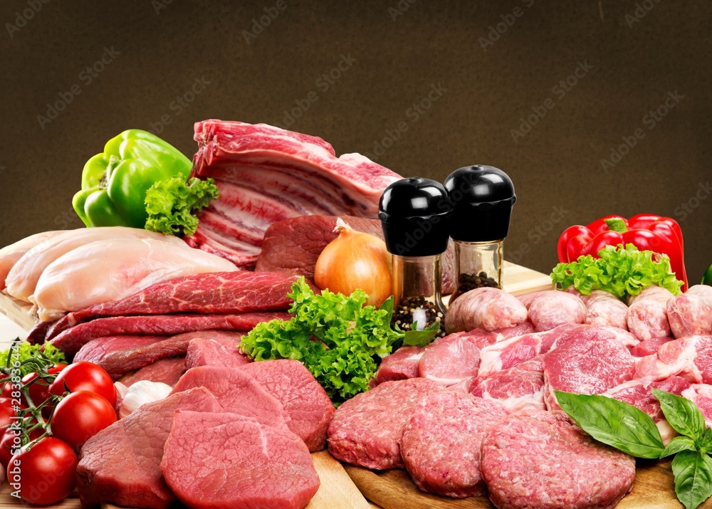 Fresh Raw Meat Background with vegetables Fresh Raw Meat Background with vegetables
