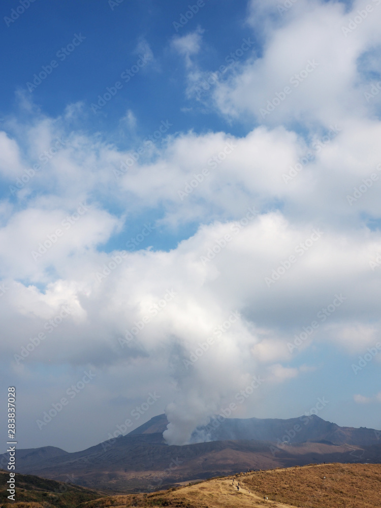 Japan's active volcano Mount Aso erupting with white smoke