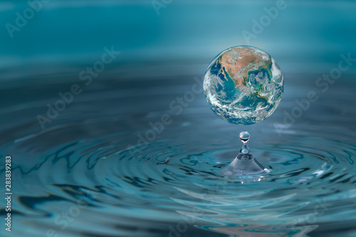 World dropping in a water drop ,concept for water pullation and conservative.Elements of this image furnished by NASA