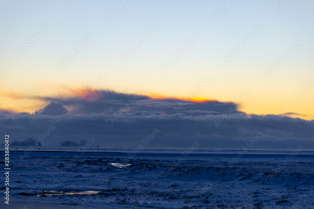 Sunset across a snowy plain