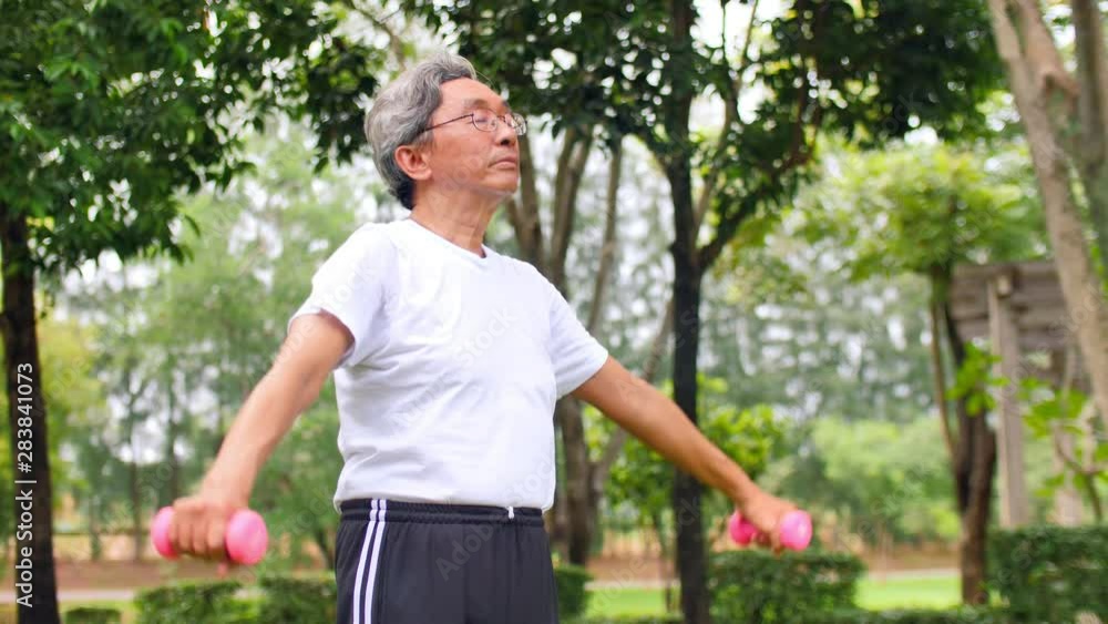 Asian senior man exercising in the park Asian senior man exercising in the park