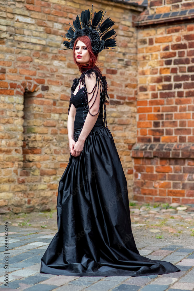 Gothic Woman in Black Dress and Feather Crown. Gothic Woman in Black Dress and Feather Crown.