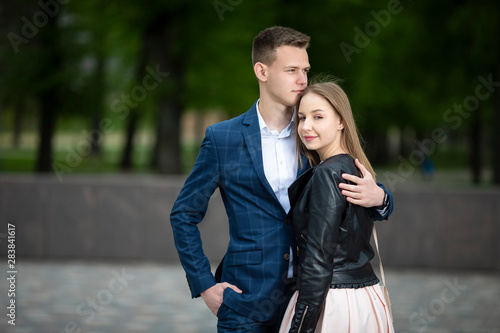 Sensual Portrait of Young Tranquil Couple in Love Embracing Outdoors in Park.
