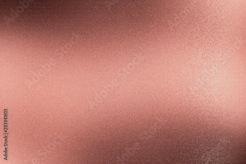 Brushed dark red metallic wall with scratched surface, abstract texture background