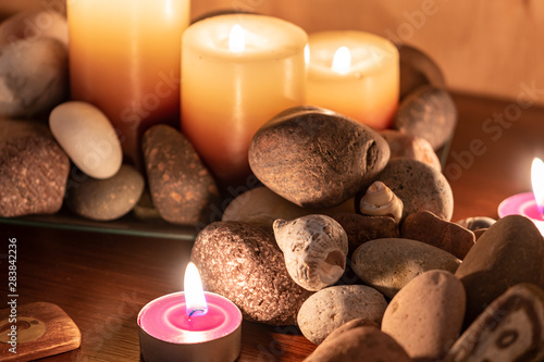 energetic stones, soft light and aromatic candles for yoga session