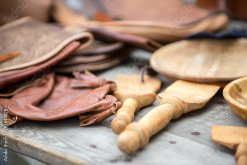 Background with blur - leather bags and wooden cooking blades.
