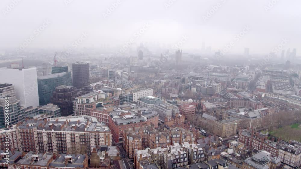 This shot depicts a panoramic view of London with a clear outlines of the most loved historical monuments surrounded by foggy mysterious atmosphere. This shot depicts a panoramic view of London with a clear outlines of the most loved historical monuments surrounded by foggy mysterious atmosphere.