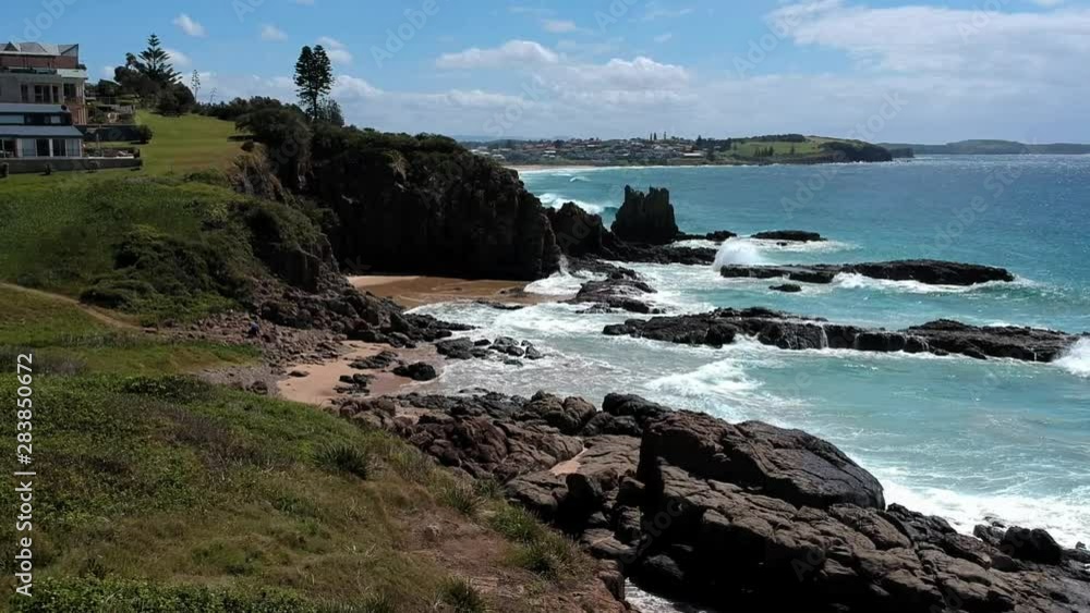Aerial drone view, moving in towards the Cathedral Rocks during the day in Kiama, New South Wales. Aerial drone view, moving in towards the Cathedral Rocks during the day in Kiama, New South Wales.
