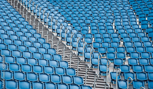 Blue plastic empty stadium  chairs in a row