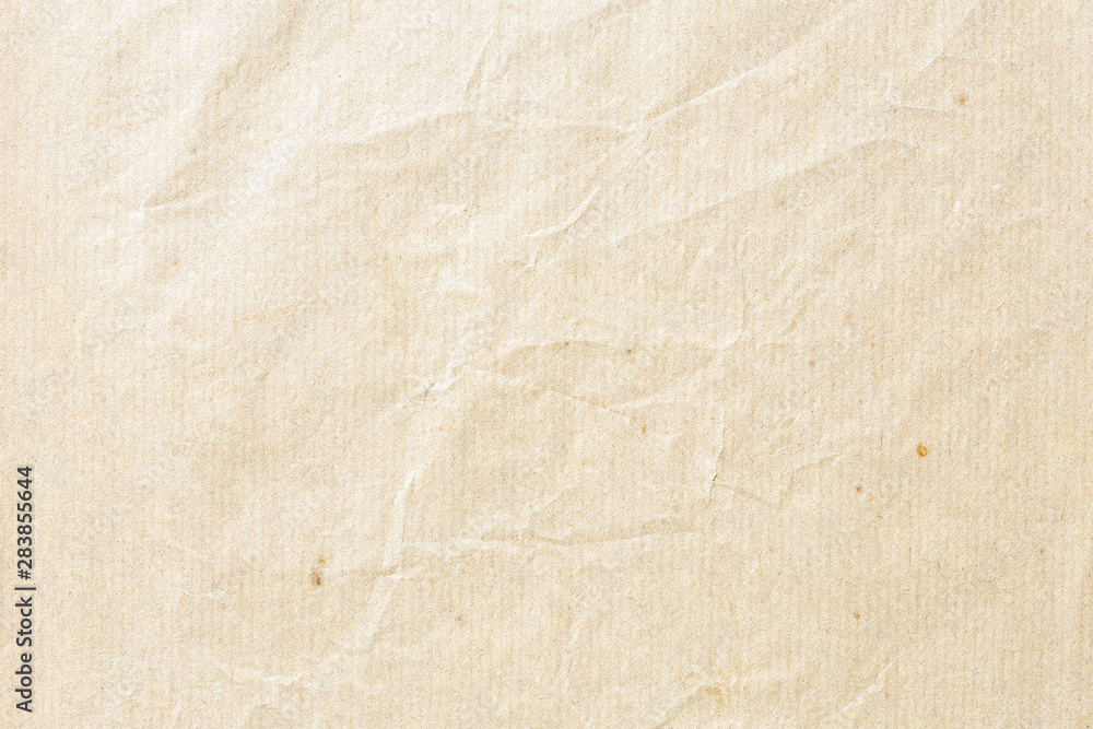 Fototapeta premium Old pale brown crumpled paper background texture