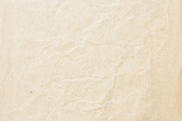 Old pale brown crumpled paper background texture
