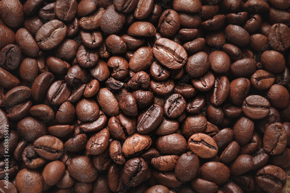 Obraz premium Roasted coffee beans close up for use abstract background texture