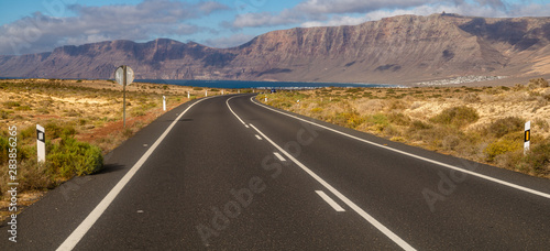 Tourist, scenic road to Lanzarote, leading to the ocean