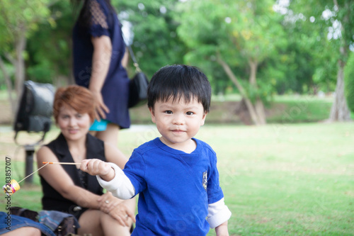 Thai boy with mom in the park