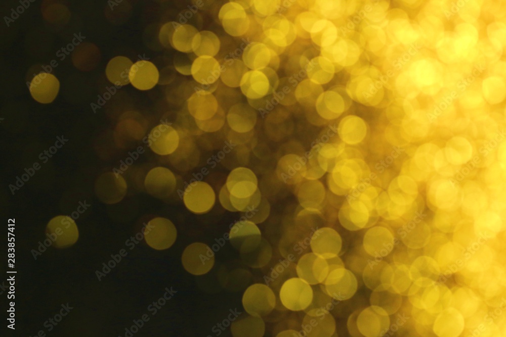 Golden glitter blurred background. Gold on black. Soft focus. Christmas and New Year holiday background Golden glitter blurred background. Gold on black. Soft focus. Christmas and New Year holiday background