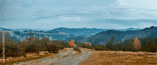 beautiful view of an autumn mountain landscape with a roug mountain road. © vitaliymateha