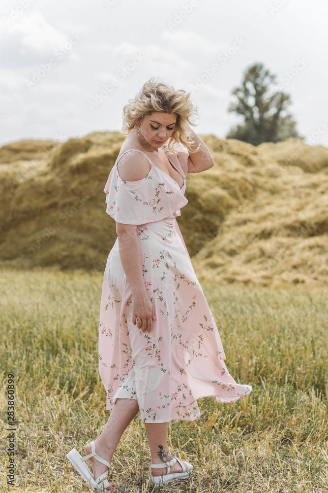 Plus size model in cotton dress. Fashion concept, clothes for l- xl size Plus size model in cotton dress. Fashion concept, clothes for l- xl size