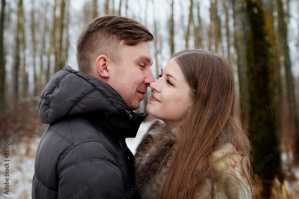 Romantic couple in love on autumn or winter walk Romantic couple in love on autumn or winter walk