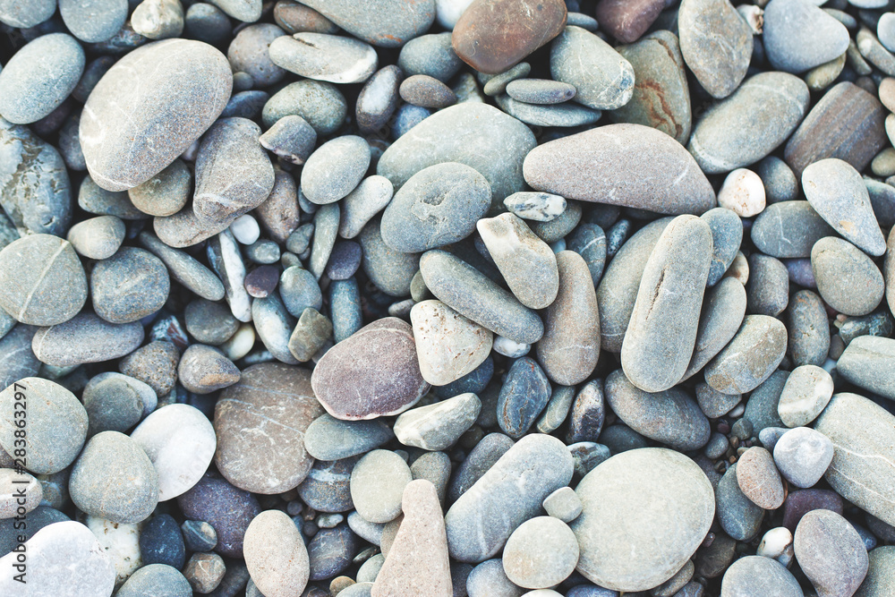 Picturesque sea pebbles close up as background Picturesque sea pebbles close up as background