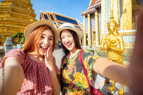 Photography Two asian girlfriends traveling and selfie by camera in smartphone in Grand Pala