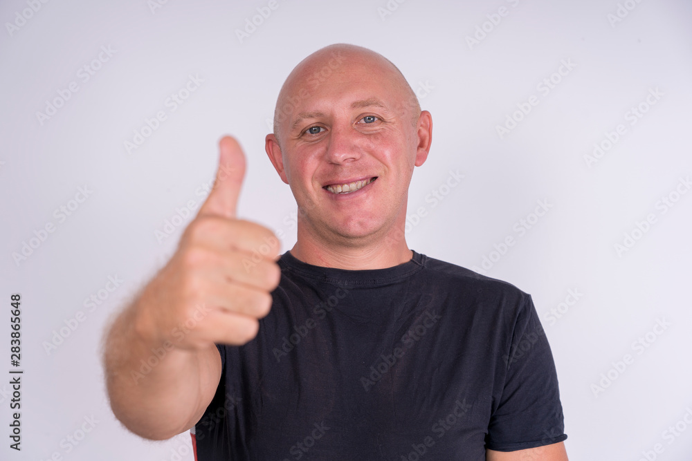 Portrait of an happy bald man, indoors, close up Portrait of an happy bald man, indoors, close up