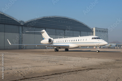 Business jet plane on the ground.