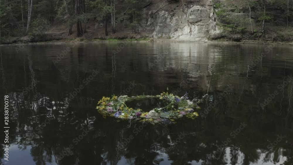 flower wreath floating around in a pond flower wreath floating around in a pond