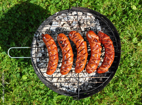 Grilling Sausages on barbecue grill